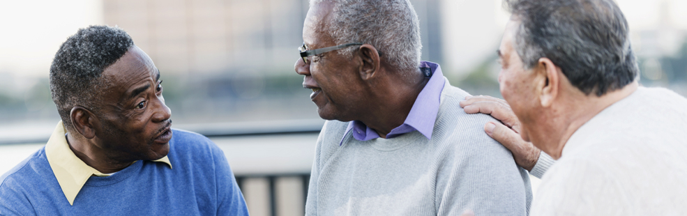 Image of medicare provided counselor with senior couple as patients.